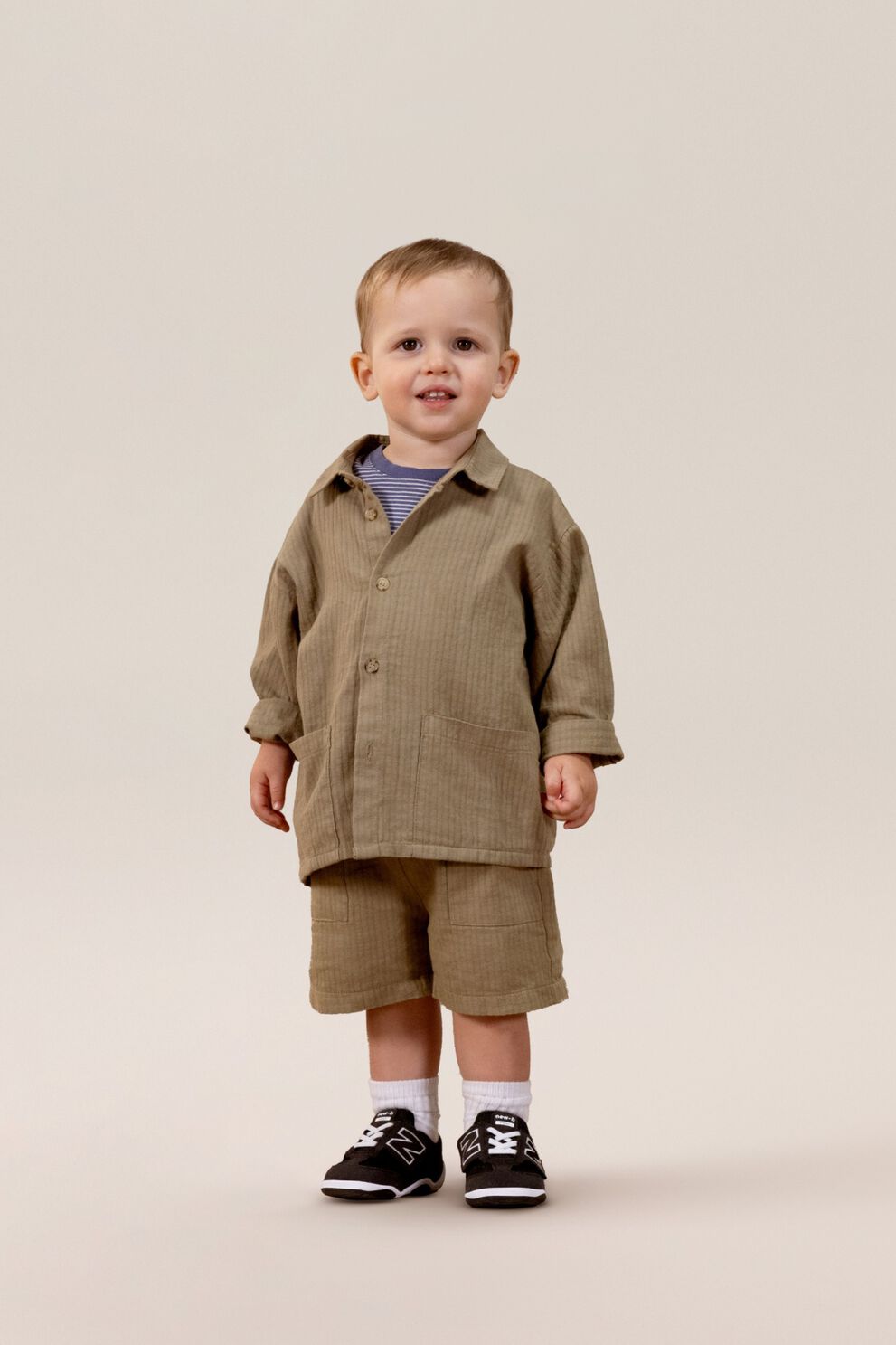 Small child standing in a matching clothing set